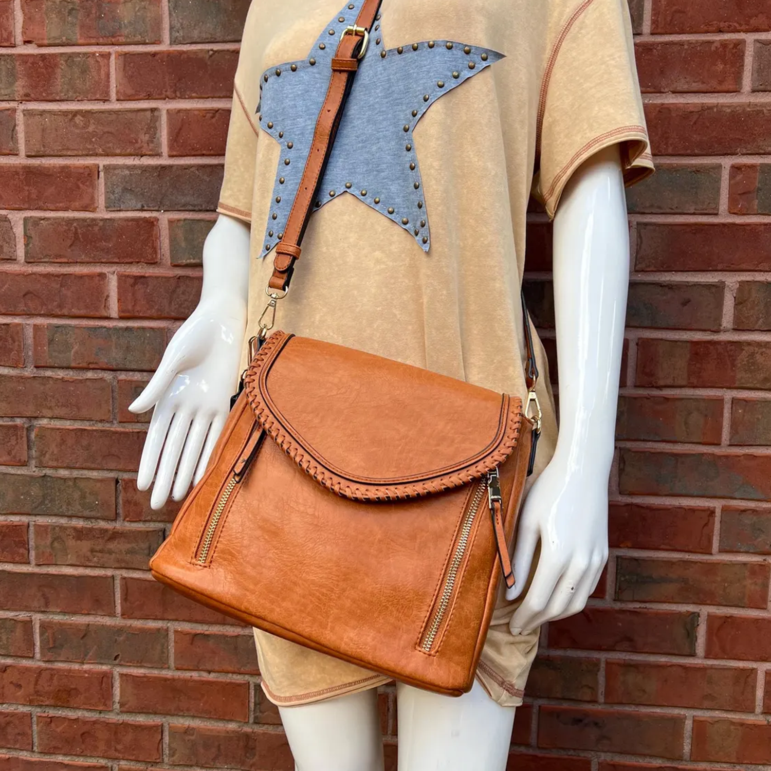 Warm Tan Whip-Stitched Curved Flap Shoulder Bag With Integrated Top Grip, Adjustable Hanging Band And Dual External Zip Storage Slots